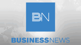 Business News logo on a grey world map background.